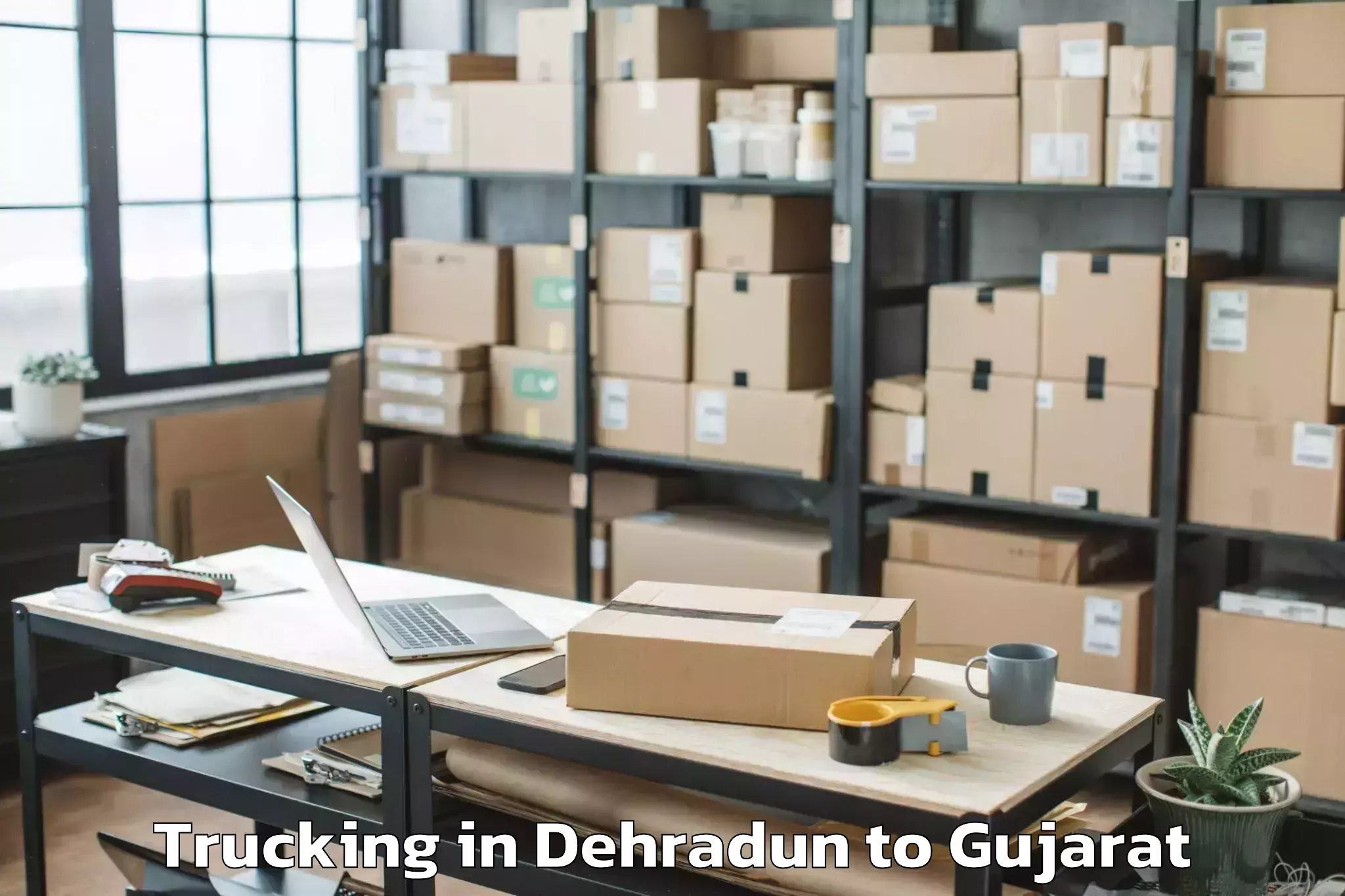 Top Dehradun to Gondal Trucking Available